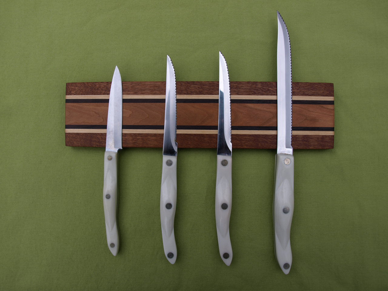 https://trimwoodworks.com/cdn/shop/products/Signature_Collection_Magnetic_Knife_Holder_-_Sapele_Maple_Cherry_1.JPG?v=1448380218
