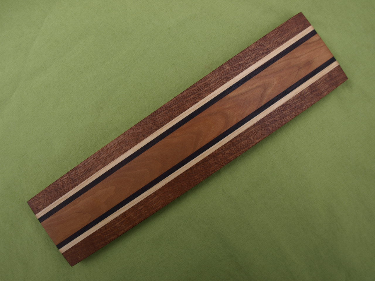 https://trimwoodworks.com/cdn/shop/products/Signature_Collection_Magnetic_Knife_Holder_-_Sapele_Maple_Cherry_2.JPG?v=1448380224